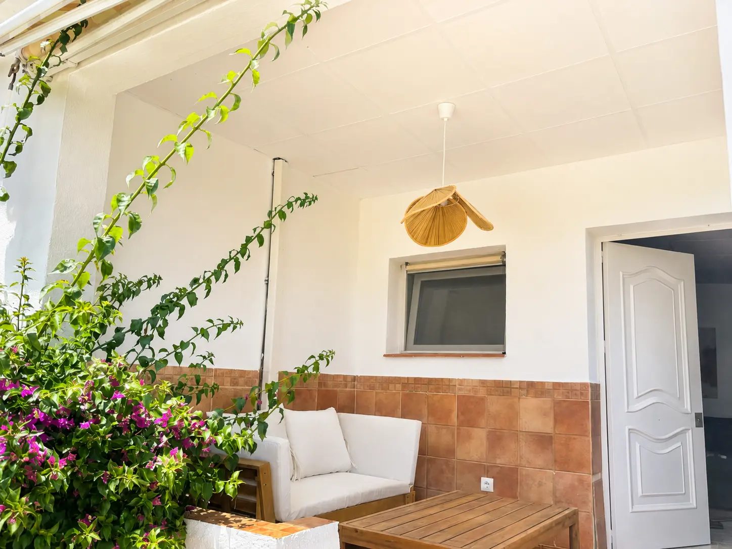 Shaded porch with bougainvillea at Casita de la Luz