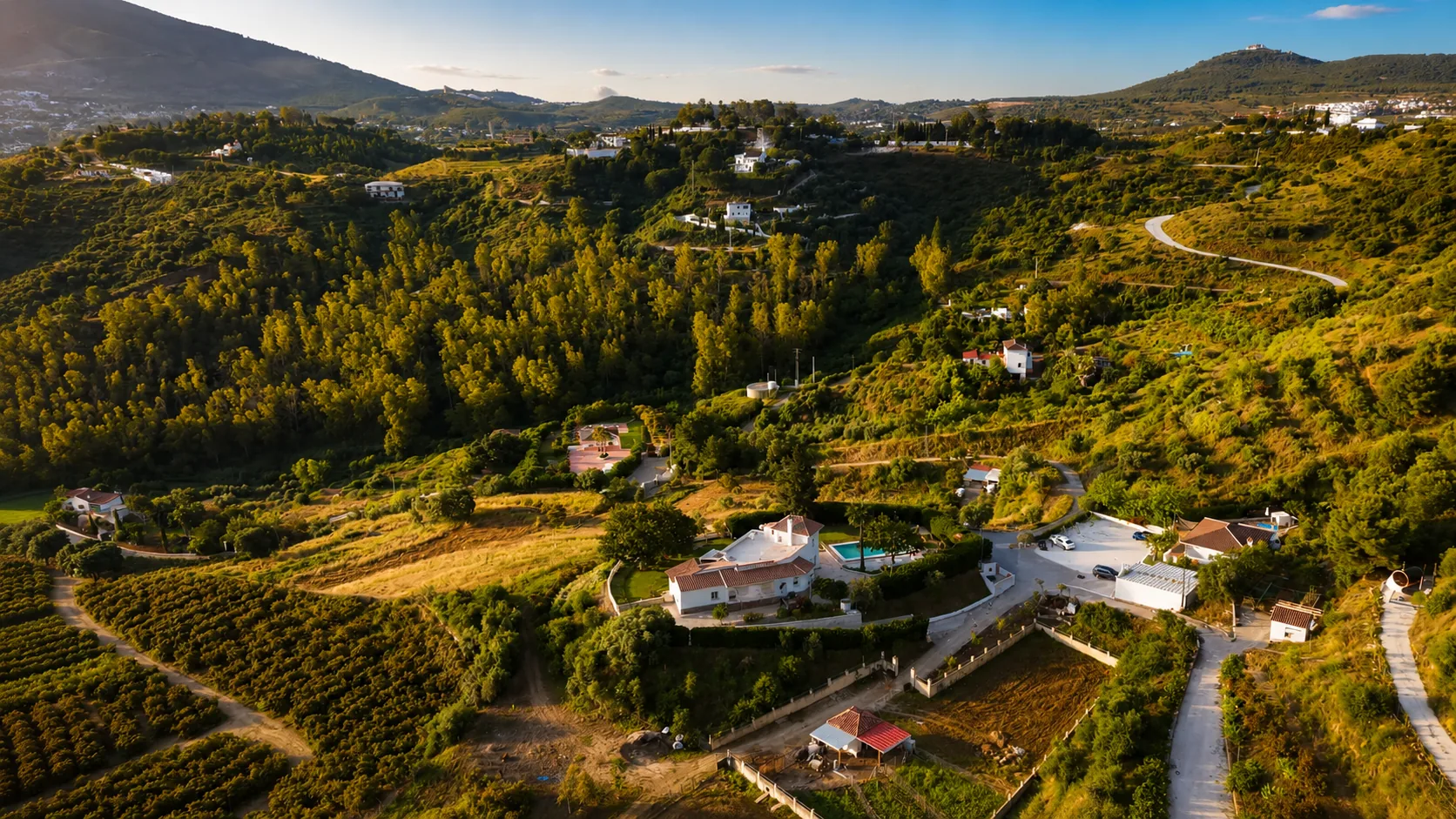 Golden hour aerial view of the Monte Valeo farm and valley in Andalusia