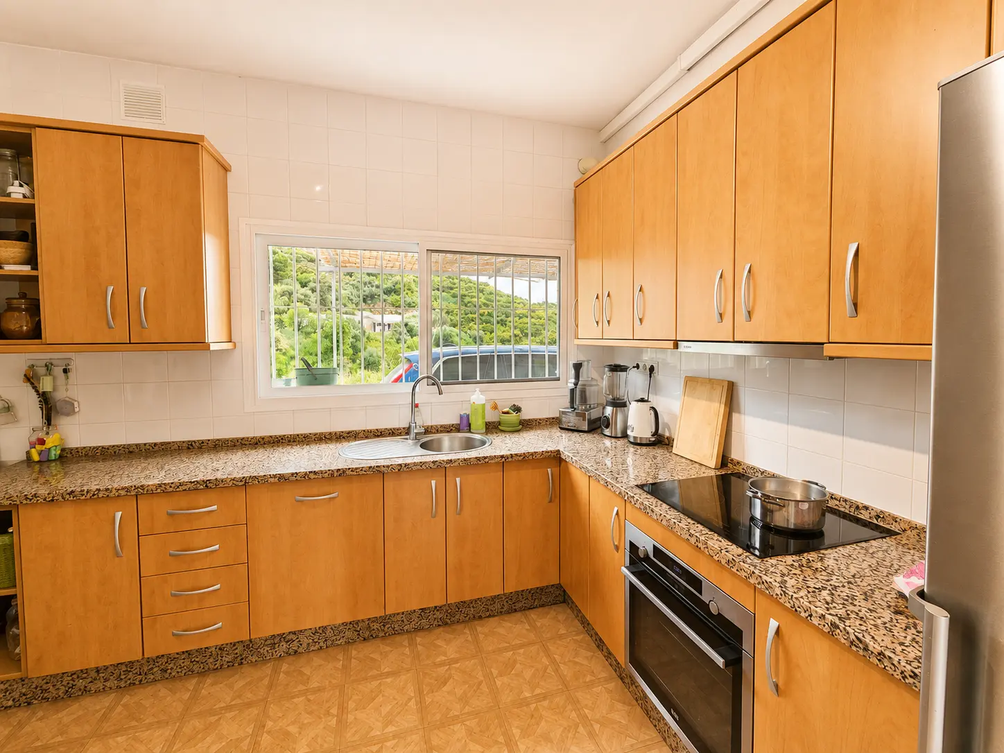 Fully equipped kitchen with countryside view at Villa Valeo