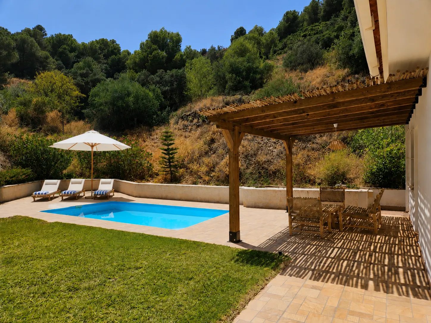 Private heated pool, lawn and pergola at Sanctuary Casa con Alma