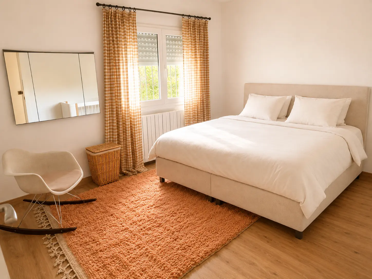 Bedroom with ochre textiles at Villa Valeo