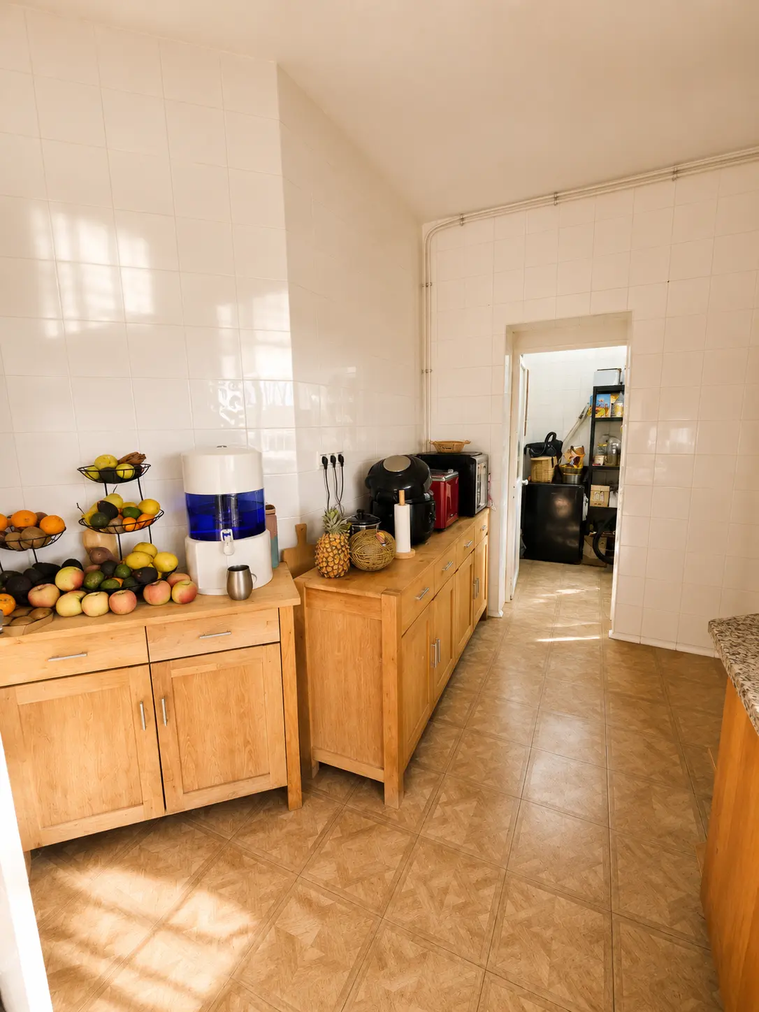 Pantry and prep kitchen with fresh fruit and filtered water at Villa Valeo